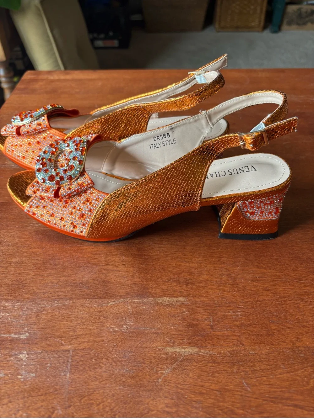 Venus Chan slingback heels w vibrant crystal-encrusted ornament on the peep toe.